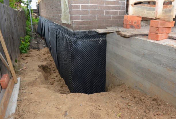 Happy homeowners after waterproofing job in Jasper